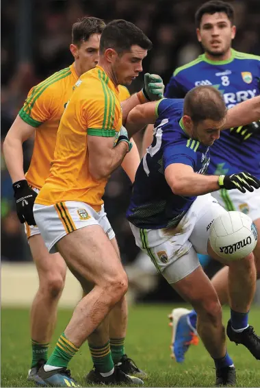  ??  ?? Stephen O’Brien of Kerry tries to shake off Meath pair Donal Keogan and Bryan Menton during Sunday’s Allianz NF