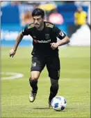  ?? Jae C. Hong Associated Press ?? TWO STARS on the Mexican national team, Jonathan dos Santos of the Galaxy, left, and LAFC’s Carlos Vela, turned down Liga MX offers to sign MLS contracts.