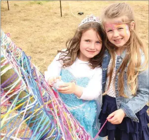  ??  ?? Teegan Hennessy and Amber Moynihan having fun at Newmarket Summer Festival’s family fun day. Photos: Eileen O’Connor