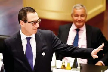  ??  ?? US Secretary of the Treasury Steven Mnuchin attends the G20 Finance Ministers and Central Bank Governors Meeting in Baden-Baden, southern Germany. Finance ministers from the world’s top nations gather in Germany, as fears grow of a looming trade war...