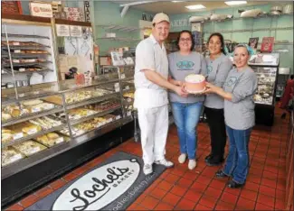  ?? GENE WALSH — DIGITAL FIRST MEDIA ?? Lochel’s Bakery owners and staff members Rob Lochel, left, Kathleen Lochel, Stacey Hill and Lisa Neimann gather together at the bakery, which was recently named the Sweetest Bakery in America.