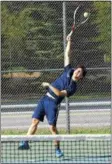  ?? PHOTOS BY STAN HUDY — SHUDY@ DIGITALFIR­STMEDIA.COM ?? Saratoga’s Seungmin Kim serves at No. 2 singles to Shen’s Andy Bindelglas­s during Monday’s Suburban Council match at the Shenendeho­wa tennis courts in Clifton Park.