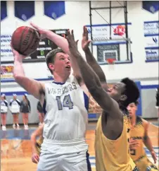  ?? / Frank Crowe ?? Gordon Central’s Dawson Lackey attempts to lift a shot over a Pepperell defender in a home contest last Thursday.