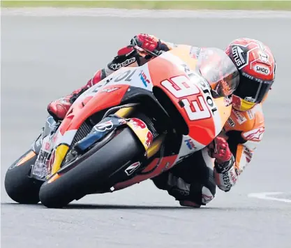  ??  ?? Marc Marquez races during the qualifying session at the Sachsenrin­g circuit.