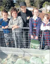  ??  ?? Compost kids: Plimmerton’s St Theresa’s School pupils are among those trialling a compost collection scheme for the city. From left, Regan Mallon, 9, Lachlan Woodsmith, 11, Choice Composting owner Leanne Pelabon, Ella Ward, 10, and Sarah King, 9.