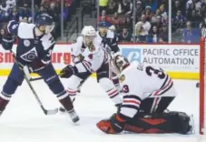  ?? Brent Lewis, The Denver Post ?? Colorado’s Carl Soderberg scores against Chicago goaltender Scott Darling on Thursday night.