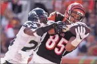  ?? Andy Lyons Getty Images ?? TYLER EIFERT of Cincinnati catches a pass for a touchdown while being defended by Seattle’s Cary Williams.