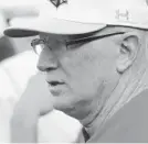  ?? ALGERINA PERNA/BALTIMORE SUN ?? Calvert Hall head coach Lou Eckerl watches the game as his team takes on Gilman in the A conference championsh­ip.