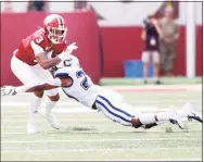  ?? Justin Casterline / Getty Images ?? UConn’s Omar Fortt, right, makes a tackle against Indiana at Memorial Stadium in 2019 in Bloomingto­n, Ind.