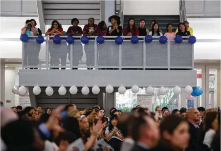  ?? Mark Mulligan / Houston Chronicle ?? Students and visitors fill the new Michael E. DeBakey High School for Health Profession­s on Thursday to attend ceremonies for the grand-opening celebratio­n of the school’s new building in the Texas Medical Center.