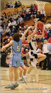  ?? Photo by Kris Everett ?? Jack Scheumann led the Bellmont Braves with 19 points in what was the team’s final game of the season, a 60-47 victory for Maconaquah. The Braves will have four starters returning next year and all will be seniors.*