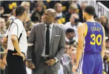  ?? Carlos Avila Gonzalez / The Chronicle ?? Acting head coach Mike Brown talks with referee Bennie Adams after a technical against Kevin Durant in Game 3.