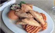  ?? RON FAIOLA ?? The bluegill plate at Stolley's Hogg Alley in Oconomowoc is one of the stars of Ron Faiola's new documentar­y "We're Here for a Fish Fry!"