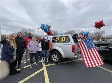  ?? MARAH MORRISON — THE NEWS-HERALD ?? Family, friends and Painesvill­e community members gathered at Harvey High School for the start of William Barnhouse’s birthday parade. The Korean War veteran will be turning 90 Nov. 29.