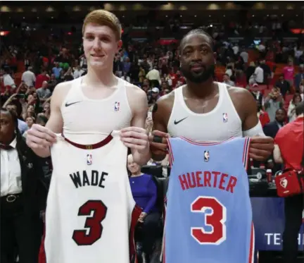  ?? WILFREDO LEE - THE ASSOCIATED PRESS ?? Miami Heat guard Dwyane Wade, right, and Atlanta Hawks guard Kevin Huerter swap jerseys after an NBA basketball game, Monday, March 4, 2019, in Miami.