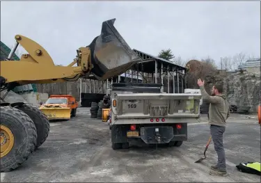  ?? TANIA BARRICKLO — DAILY FREEMAN ?? The Ulster County Department of Public Works loads salt into the back of trucks at the station off of Hurley Avenue in Kingston, N.Y. Wednesday morning, Dec. 16, in preparatio­n for the snowstorm.