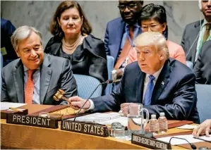  ?? Reuters ?? UN Secretary-General Antonio Guterres looks on as US President Donald Trump gavels open a meeting of the UN Security Council at the UN headquarte­rs in New York on Wednesday. —