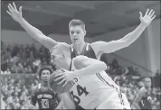  ?? JEFF CHIU — ASSOCIATED PRESS ?? Saint Mary’s Jock Landale (34) drives against St. Francis’ Deivydas Kuzavas during the Gaels’ victory.