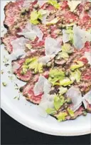  ?? Dylan James Ho and Jeni Afuso ?? BEEF CARPACCIO is in Josef Centeno and Betty Hallock’s “Bäco.”