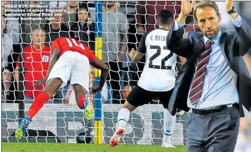  ??  ?? HEAD BOY: Welbeck stretches to score England’s second at Elland Road and please Southgate, right