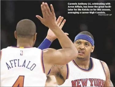  ??  ?? Carmelo Anthony (r), celebratin­g with Arron Afflalo, has been the great facilitato­r for the Knicks so far this season, averaging a career-high 4 assists.