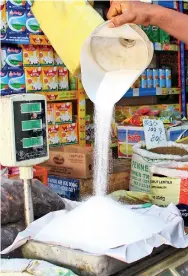  ??  ?? Traditiona­l sweetmeats going at high prices with the Govt's move to remove the price control on sugar. Pic by Indika Handuwala