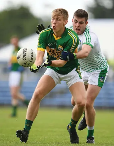  ??  ?? Killian Spillane in action against James Bridgeman of Limerick during the Munster Junior Football Championsh­ip semi-final at Cusack Park, in Ennis, Co. Clare. Photo by Sportsfile