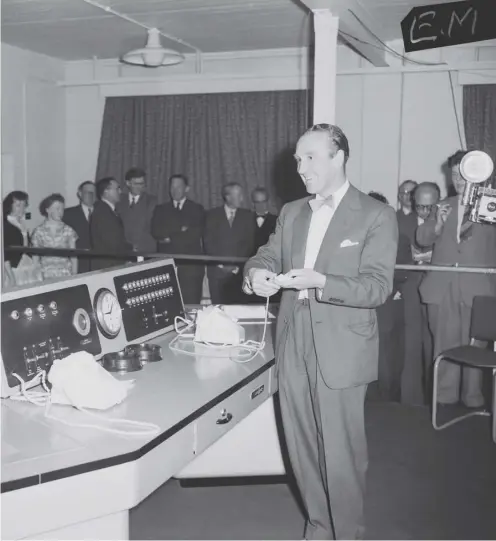  ?? ?? Ernest Marples presses the button of ‘Ernie’ to generate the winning number in the first premium bond savings draw in June 1957