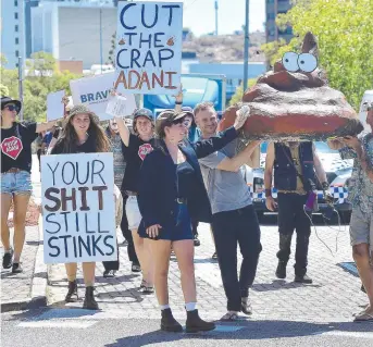  ??  ?? Environmen­tal activists gathered at Bravus Mining’s headquarte­rs in Townsville to "call out" Adani’s rebranding. Picture: MATT TAYLOR.