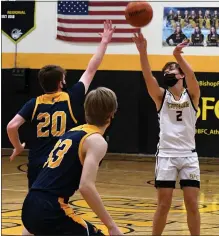  ?? DREW ELLIS — MEDIANEWS GROUP ?? Madison Heights Bishop Foley’s Dylan Gough (2) knocks down one of the Ventures’ 113-pointers on Wednesday in a 63-46win over Royal Oak Shrine.