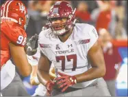  ?? Getty Images ?? Offensive lineman Jaelin Robinson (77) and Temple face UConn on Saturday at Rentschler Field.