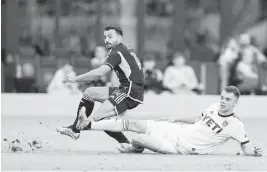  ?? MATIAS J. OCNER mocner@miamiheral­d.com ?? Inter Miami forward Coco Jean scores in the 61st minute while Austin FC’s Leo Vaisanen tries to defend during their friendly soccer match at DRV PNK Stadium on Saturday.