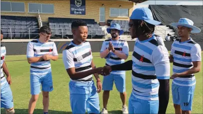  ?? ?? First cap: Maphane, a product of BCA developmen­t programme, receives his cap from captain Motlhanka