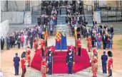  ?? —AFP ?? People file past the coffin of Queen Elizabeth II on the catafalque in Westminste­r Hall, London, on Thursday
