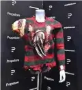  ?? ?? The Protruding Glove and Sweater worn by Freddy Krueger, played by Robert Englund in the 2003 film “Freddy vs. Jason” is displayed at Propstore.