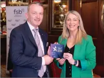  ?? ?? Roisin Mcaliskey, Developmen­t Manager from the Federation of Small Businesses, presenting the Northern Ireland Community award to David Donaldson, from LE Graphics, Enniskille­n. Image: Federation of Small Businesses
