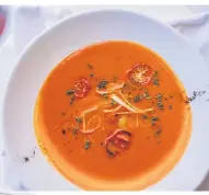  ??  ?? DISHY. Smoked tomato and red pepper soup served with celery ribbon and confit.