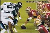  ?? TONY AVELAR — THE ASSOCIATED PRESS FILE ?? San Francisco 49ers center Ben Garland (63) prepares to snap the ball at the line of scrimmage against the Philadelph­ia Eagles in Santa Clara on Sunday.