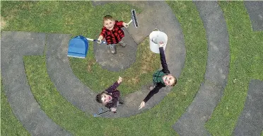  ?? WARWICK SMITH/STUFF ?? Caleb, 7, Anthony, 8, and Brendon Hazel, 5, are worried about the effects litter has on birds and sea life.