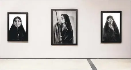  ?? Joshua White JWPicture ?? SHIRIN Neshat’s “Women of Allah” series includes self-portraits of the artist covered in dramatic calligraph­y. It’s on view at the Broad.