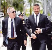  ?? C.M. GUERRERO cmguerrero@miamiheral­d.com ?? Jorge Mas, left, and David Beckham on their way to make their case before the Miami City Commission in July.