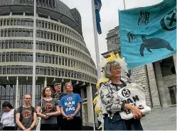  ?? PHOTO: GED CANN/STUFF ?? The 65,000 signatures to the petition calling for a ban on plastic bags were passed over in a fabric bag yesterday at Parliament in Wellington.