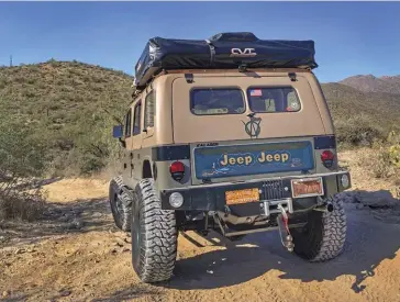  ??  ?? The custom double-wide tailgate built by Proto Fab folds flat onto the rear military-style bumper.