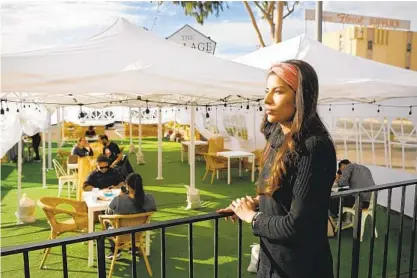  ?? K.C. ALFRED U-T ?? Alondra Ruiz, owner of The Village SD, opened outdoor seating at the restaurant on El Cajon Boulevard on Wednesday.