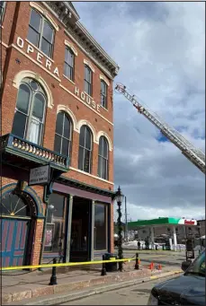  ?? PROVIDED BY PROVIDED BY TABOR OPERA HOUSE PRESERVATI­ON COMMISSION ?? Bricks falling from the facade of Leadville’s Tabor Opera House closed the sidewalk and part of the road along U.S. Route 24 on Saturday.