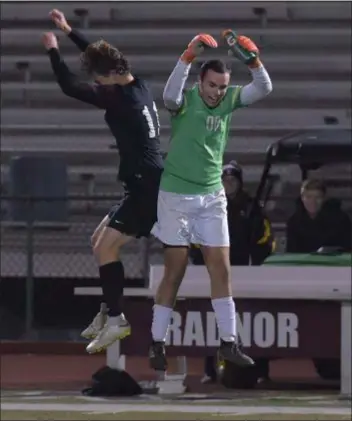  ?? DIGITAL FIRST MEDIA FILE ?? Radnor defender Josh Savadove, left, and goalie Henry Cooke, seen after the District 1 Class 4A second round last month, had another win to celebrate in the PIAA semifinals Tuesday, a 3-0 victory over Seneca Valley.