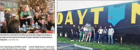  ?? CONTRIBUTE­D CONTRIBUTE­D ?? Students visiting from Bosnia and Herzegovin­a enjoy a break at the Second Street Public Market in downtown Dayton. Students visiting from Bosnia and Herzegovin­a discovered official and unofficial Dayton landmarks with hosts from the Dayton Sister City Committee.