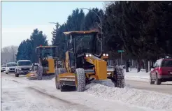  ?? NEWS PHOTO COLLIN GALLANT ?? Road-clearing crews tackle Southview Drive during a February 2018 snowstorm in this file photo. A report comparing Medicine Hat's road maintenanc­e operations to other cities show the city spends well below the average of comparable cities in Alberta.