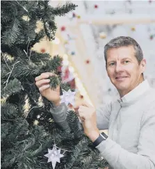  ??  ?? Steve Cram at the St Benedict’s Hospice tree . Picture: Stuart Boulton.