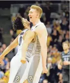 ?? ASSOCIATED PRESS ?? Sam Hauser (right) and Markus Howard will be key juniors next season for Marquette.